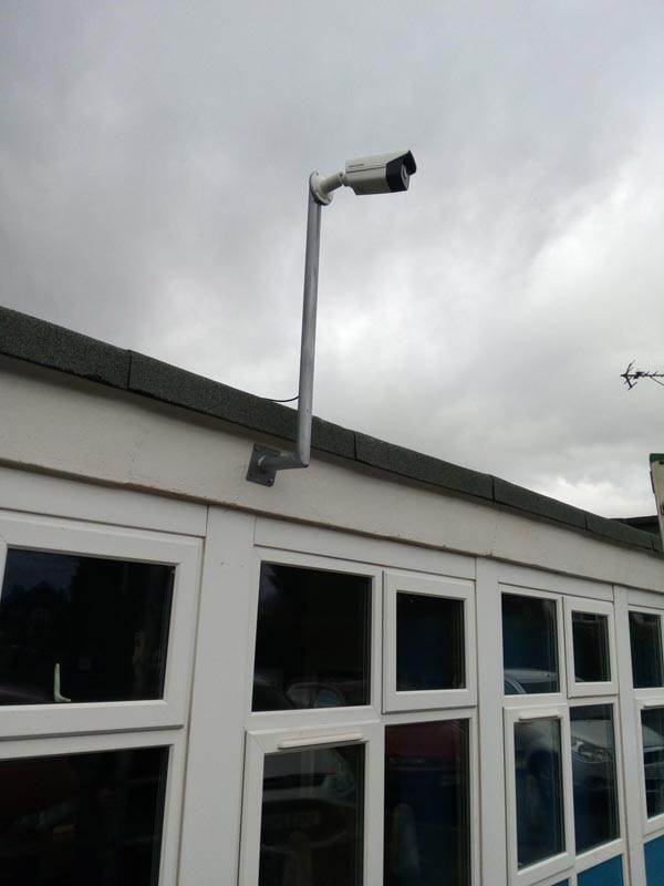 Low roof on a school we made a 2M bracket with a 12 degree pitch to fit the fascia and keep the bracket vertical
